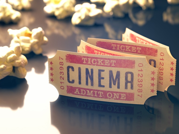 Movie tickets and popcorn image