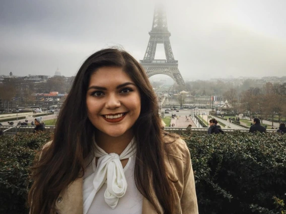 Student Lisdye in front of Eiffel Tower